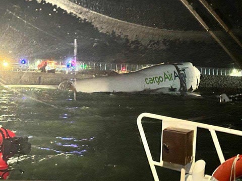 Wreckage of cargo plane at Hong Kong International Airport.