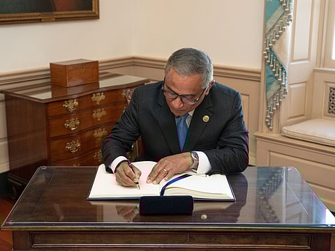 Belize Prime Minister John Briceno signs Secretary of State Antony J. Blinken's guestbook before their bilateral meeting at the U.S. Department of State in Washington, D.C., on September 26, 2022. 