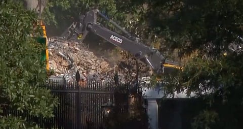 Excavators seen dismantling the White House's East Wing.
