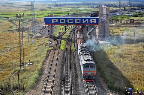  A freight train pulled by Russian 2TE10M-2766 diesel locomotive travels from the China-Russia railway port to Manchuria, China