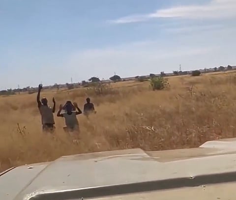Screengrab from a footage posted on X purporting to show Sudanese Armed Forces (SAF) fighters capturing four Rapid Support Forces (RSF) members in a rural Sudanese landscape.