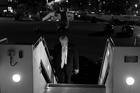 President Donald Trump boards Air Force One as he departs Palm Beach International Airport in West Palm Beach, Florida on Sunday, January 4, 2026, en route Joint Base Andrews, Maryland.