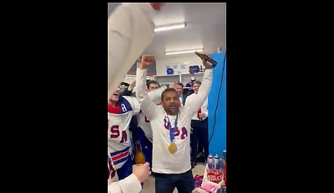 FBI Director Kash Patel joining the US men's Olympic hockey team's locker room celebration after their gold medal win over Canada in the 2026 Milan Winter Olympics final.