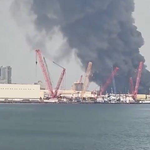Smoke rises in the sky after strikes in Bahrain, on Saturday, February 28, 2026.