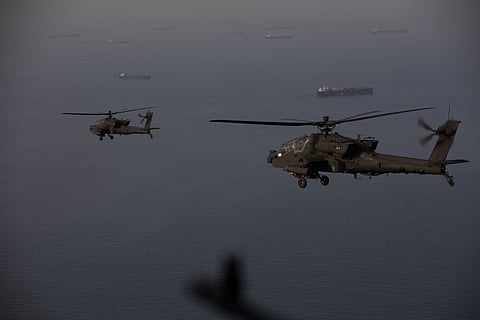 U.S. AH-64 Apaches fly above the Strait of Hormuz during a patrol, April 17. 