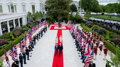 President Donald J. Trump, King Charles III, First Lady Melania Trump and Queen Camilla walk through the White House Rose Garden to the Oval Office, Tuesday, April 28, 2026.
