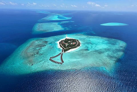 Alimatha Island in Vaavu Atoll is a popular Maldives diving destination known for its coral reefs, marine life and deep underwater cave systems.