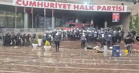 Turkish riot police using tear gas and force to enter the CHP opposition party's Ankara headquarters.