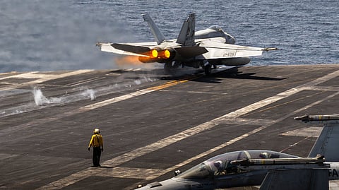 A U.S. Navy fighter jet launches from aircraft carrier USS Abraham Lincoln (CVN 72) in the Arabian Sea. 