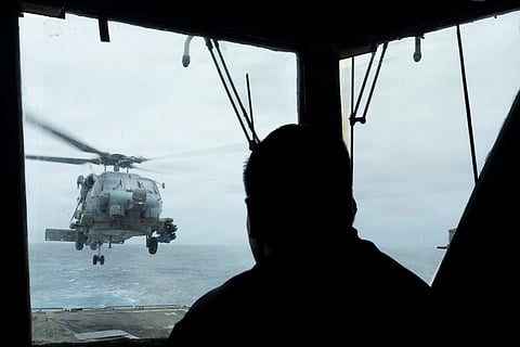 An MH-60 Sea Hawk helicopter lifts off from the flight deck of USS Delbert D. Black (DDG 119) as the ship transits the Arabian Sea.