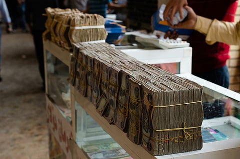 Why Has Iraq Devalued Its Currency, and Why Are Some MPs Opposing It?