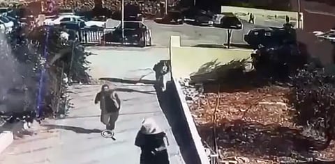 Surveillance footage of gunmen arriving by car and opening fire outside a Greek Orthodox church in Hammoud, Karak governorate, Jordan. 