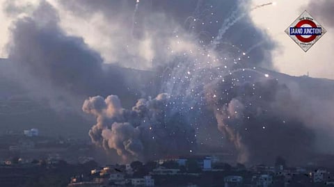 Smoke billows following Israeli strikes in Tyre, Lebanon on Monday evening amid Israel-Hezbollah conflict. 
