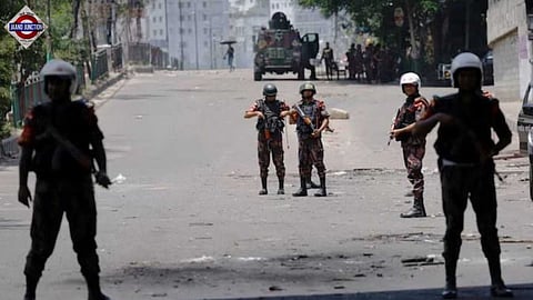 Bangladesh Army members stand in guard in Dhaka. 