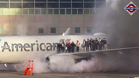 Video: American Airlines plane catches fire, passengers evacuate onto wings