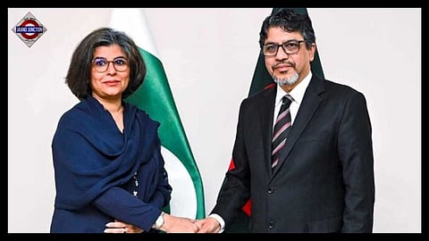 Bangladesh Foreign Secretary Md Jashim Uddin, right, shakes hands with Pakistan Foreign Secretary Amna Baloch.