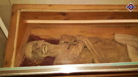 The mummy of the 'air-dried chaplain' in his coffin in the church crypt of St. Thomas am Blasenstein