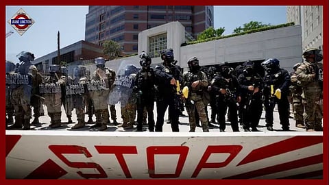 California National Guard troops stand outside the Edward R. Roybal federal building, in Los Angeles.