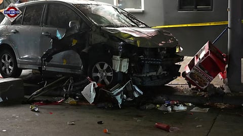 A vehicle sits on the sidewalk after ramming into a crowd of people waiting to enter a nightclub along a busy boulevard in Los Angeles.