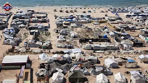 Tents and shelters for Palestinians displaced by conflict are pictured erected at a make-shift camp along the beach near the seaport in the west of Gaza City on July 19, 2025.