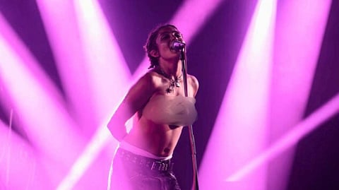 French Singer Rebecca Baby Protests Sexual Harassment by Performing Topless at Festival