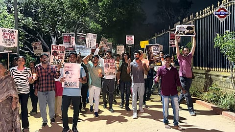 Citizens gather outside KBR National Park during a candlelight #SaveKBR protest against tree felling and the proposed H-CITI flyover project in Hyderabad.