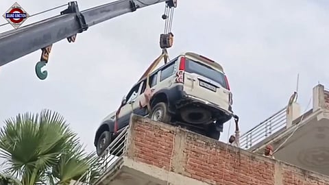 Bihar man lifts new SUV to 2nd-floor rooftop with crane to protect it from theft