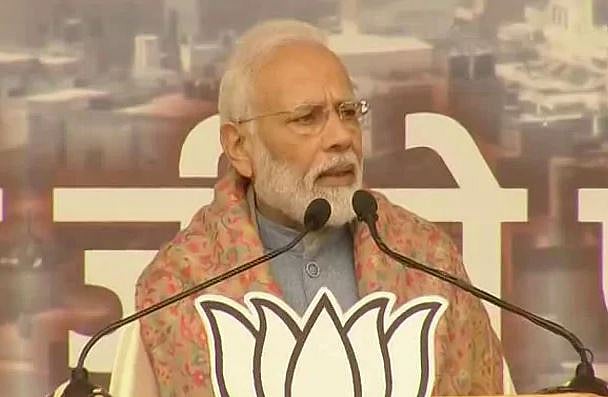 மிரட்டும் அமித் ஷா.. தேன் தடவிப் பேசும் மோடி : இந்தியர்களின் கழுத்தை நெறுக்கும் கொலைகார CAA, NRC