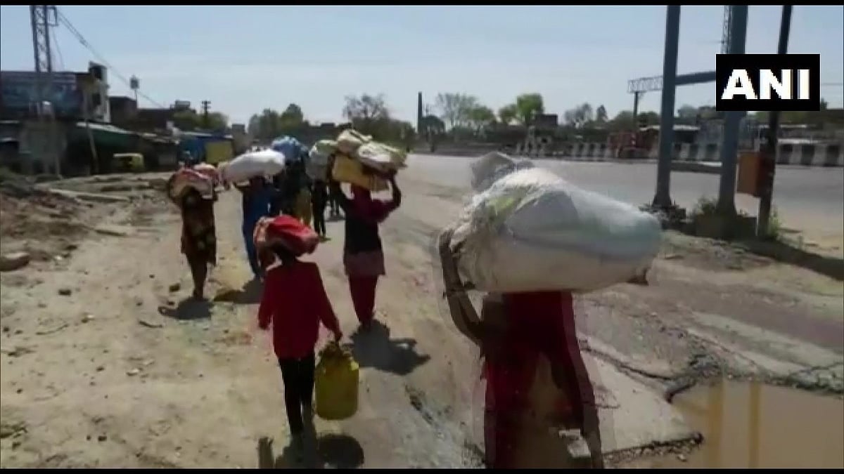 கொரோனா ஊரடங்கால் முடங்கிய பிழைப்பு... சொந்த ஊர்களுக்கு கால்நடையாகவே படையெடுத்த கூலித் தொழிலாளர்கள்!