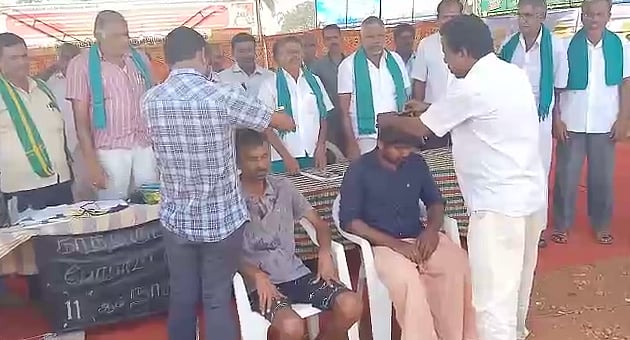 உயர்மின் கோபுரம் திட்டத்துக்கு எதிராக காத்திருப்பு போராட்டம்: மொட்டையடித்து போராடிய திருப்பூர் விவசாயிகள்