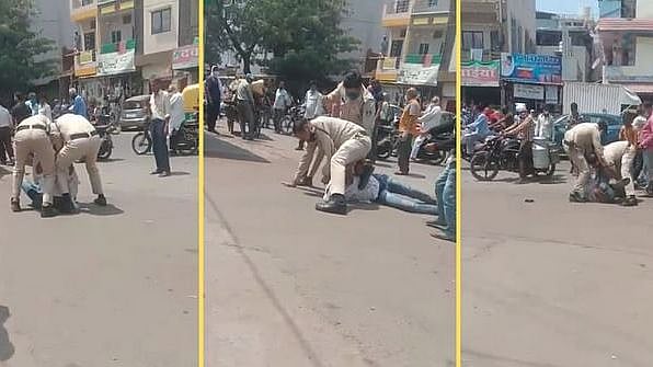 மாஸ்க் தவறுதலாக கழன்று விழுந்ததால் இளைஞரை அடித்து உதைத்த போலிஸார் - இந்தூரில் கொடூரம்!