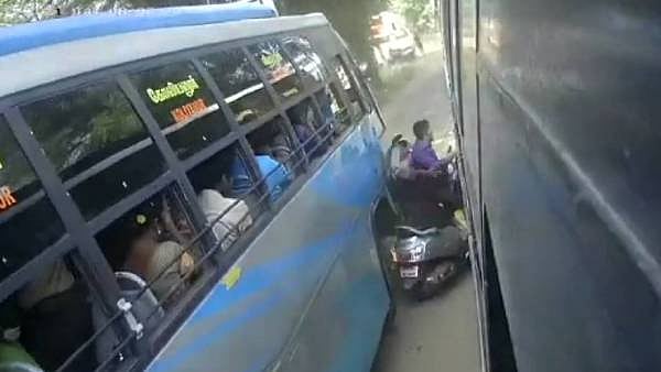 கைக்குழந்தையுடன் பேருந்துகளுக்கு இடையே சிக்கி உயிர்தப்பிய தம்பதி... பதைபதைக்க வைக்கும் CCTV காட்சி!