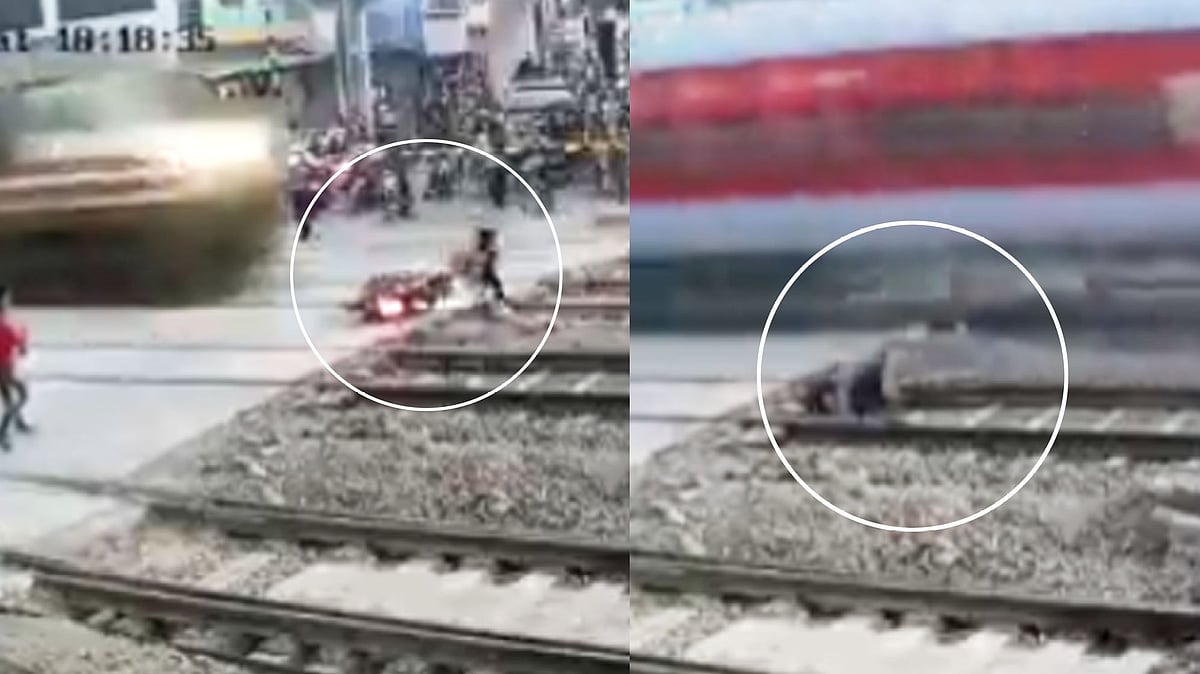 “ரயில் மோதி சுக்கு நூறாக சிதறிய இருசக்கர வாகனம்.. நூலிழையில் உயிர் தப்பிய இளைஞர்” : பதறவைக்கும் video!