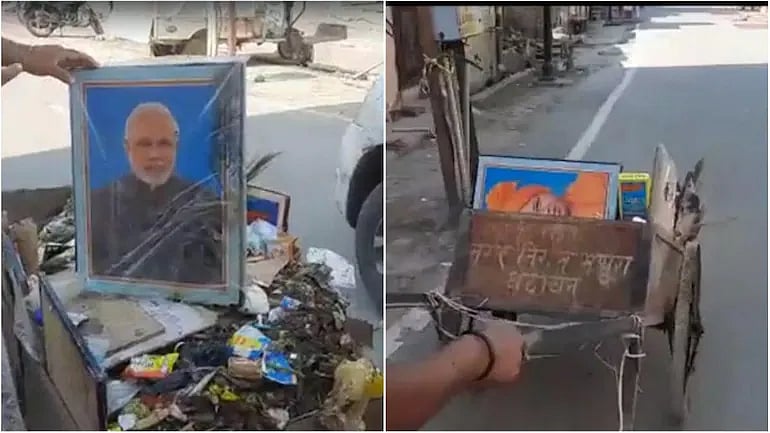 உ.பியில் குப்பை வண்டியில் இருந்த மோடி, யோகி புகைப்படங்கள்.. தண்டனையாக தூய்மை பணியாளர் பணி நீக்கம்! 