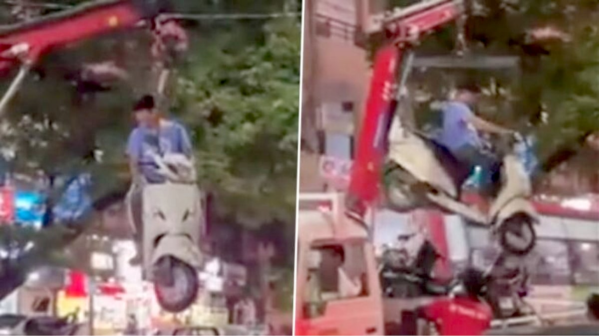 No Parking-ல் நிறுத்தப்பட்ட வாகனம் : உரிமையாளருடன் அலேக்காக கிரேனில் தூக்கிய போலிஸ்! - வைரலாகும் வீடியோ !