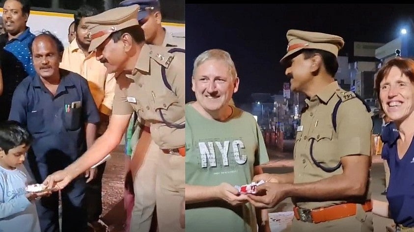 பொதுமக்களுடன் இணைந்து கேக் வெட்டி புத்தாண்டை கொண்டாடிய காவலர்கள்: வியந்து பார்த்த வெளிநாட்டுப் பயணிகள்!
