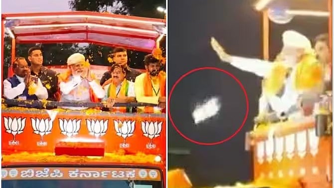 மோடி மீது வீசப்பட்ட செல்போன்... சிக்கிய பாஜக தொண்டர்.. கைகாட்டும்போது தவறி வீசியதாக போலிஸார் விளக்கம் !