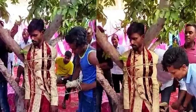 திடீரென வரதட்சணை அதிகம் கேட்டதால் ஆத்திரம்.. மணமகனை மணக்கோலத்தில் மரத்தில் கட்டிவைத்த பெண் வீட்டார் !