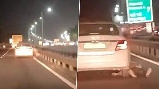 கார் சக்கரத்தில் தரதரவென்று இழுத்துச் செல்லப்பட்ட சடலம்.. இணையத்தில் வைரலாகும் மனதை பதறவைக்கும் வீடியோ!