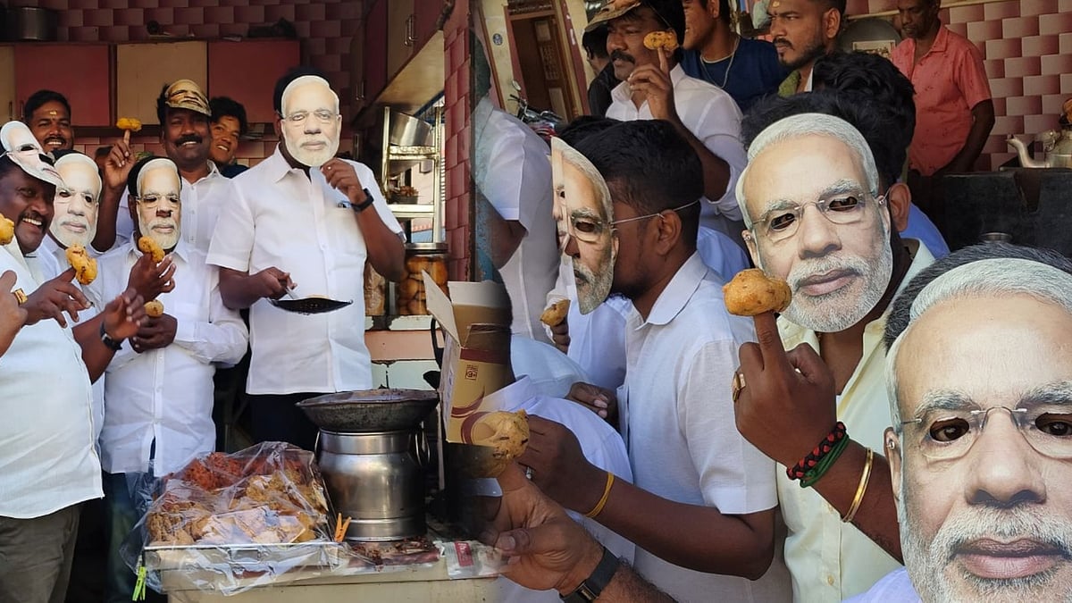 “வாயாலே பொய் வடைகளை சுடும் பிரதமர்...” : மோடி உருவம் பதித்த முகமூடி அணிந்து நூதன போராட்டம் ! 