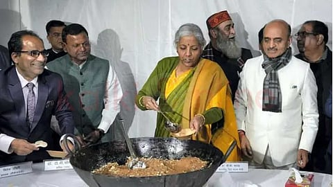 What is the connection between the central government's budget and giving halwa?