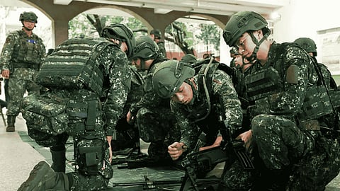A Taiwanese soldier trains next to Patriot missile systems during the Han Kuang military exercise 