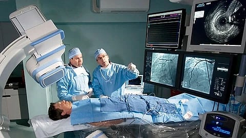 doctors examing patient using hi tech equipment