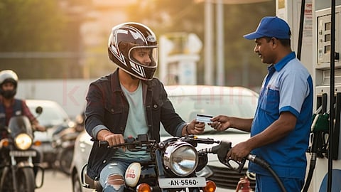 a young man give credit card to pay for petrol