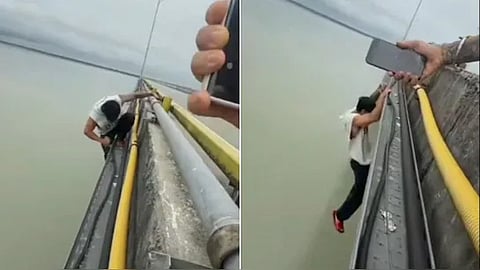 Man Hangs Off Bridge