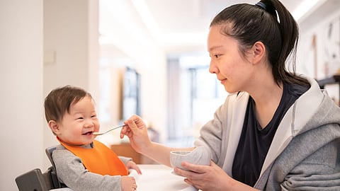 Mom feeding to child