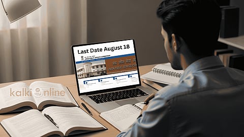 A Guy studying at a desk with a laptop showing UPSC.