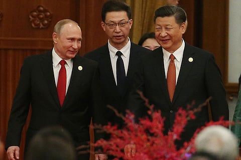 Chinese President Xi Jinping pledged to work with counterpart Vladimir Putin