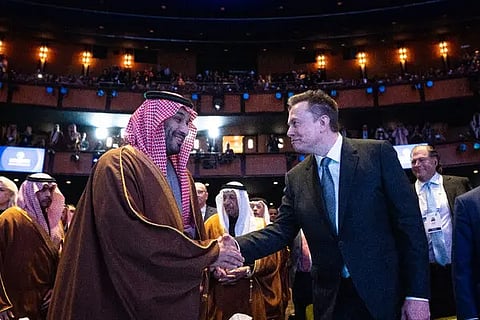 Delegates greet each other at a major global tech forum