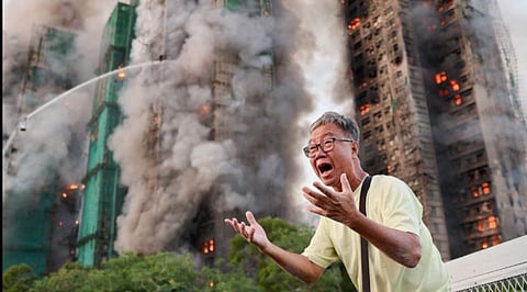 Smoke and flames engulf towers during Hong Kong fire